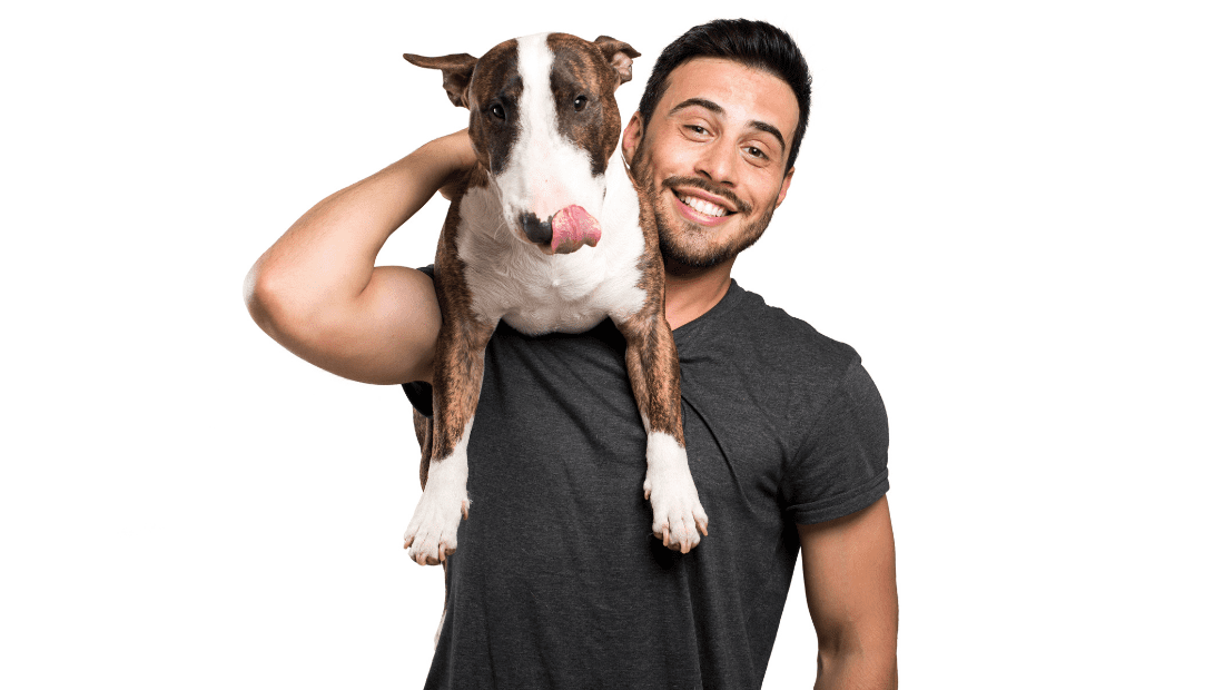 A man with a dog on his shoulder
